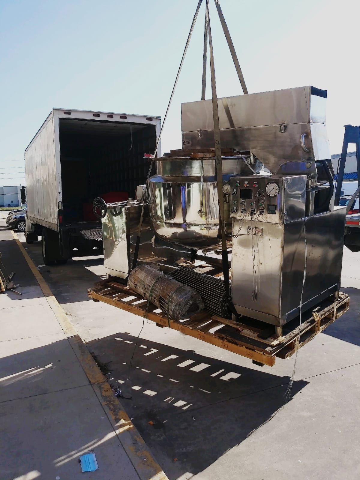 A large truck with a trailer and some machines